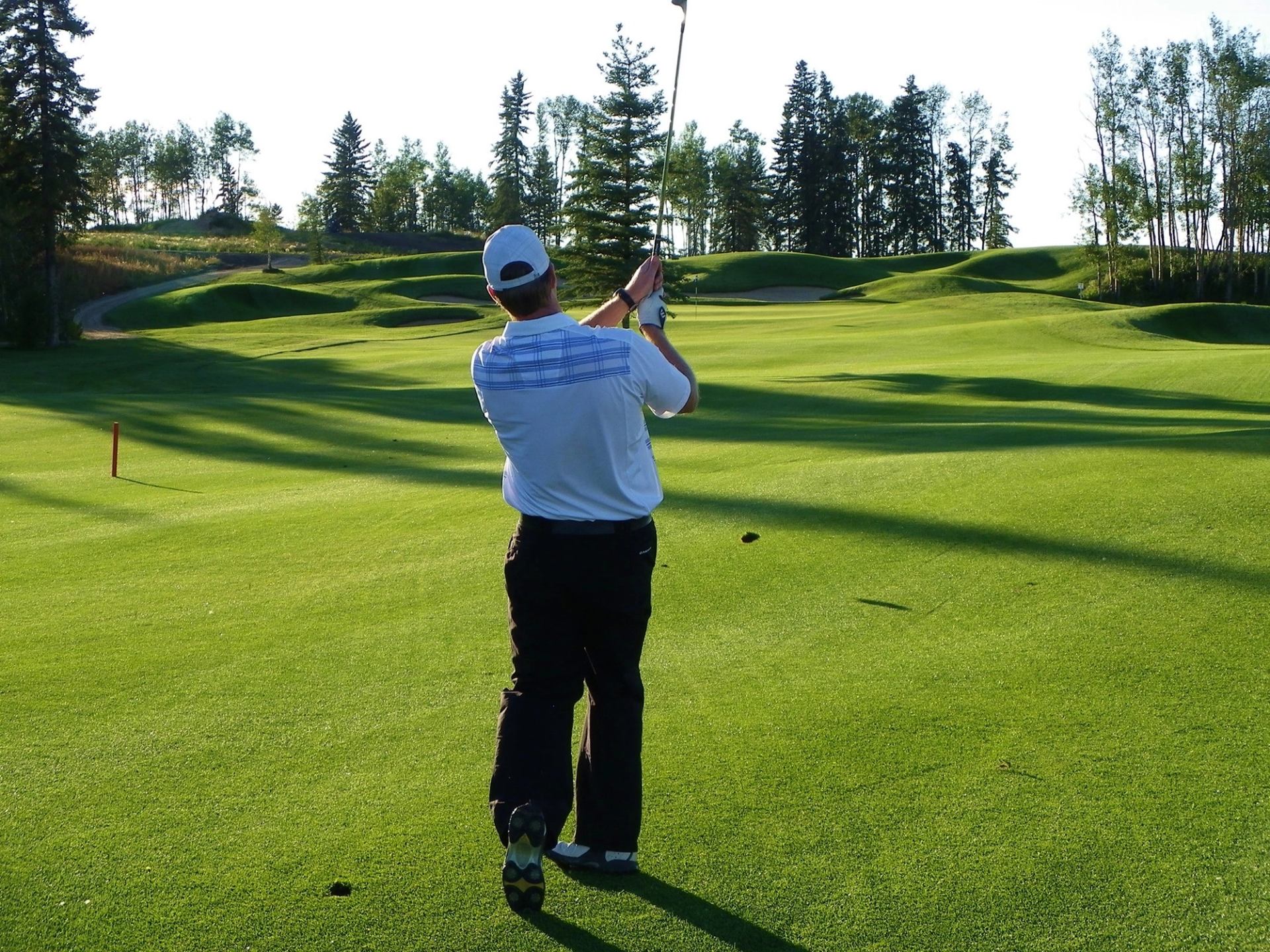 Person golfing at Trestle Creek Golf Resort.
