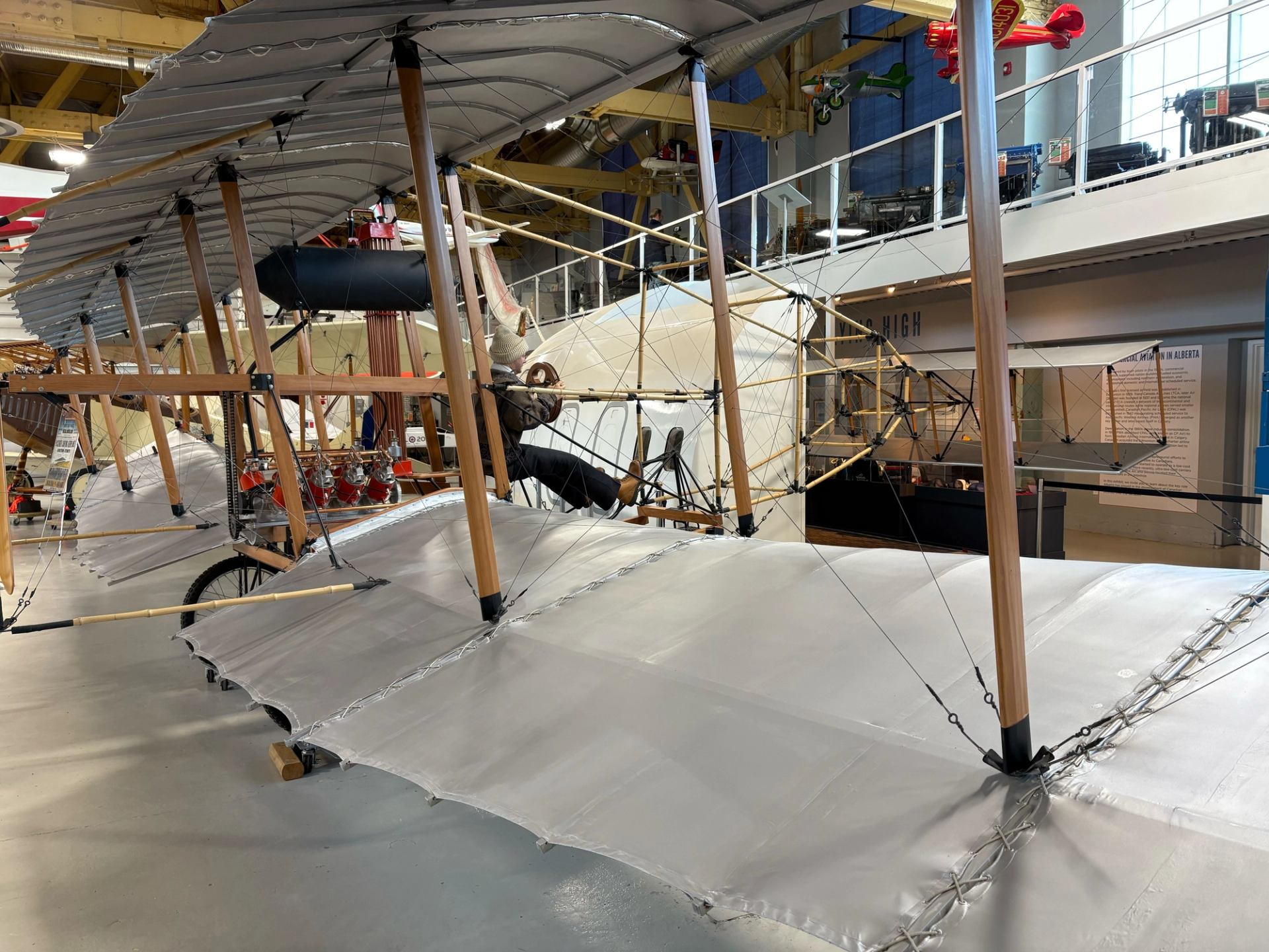 Historic early aircraft displayed inside an aviation museum hangar during National Aviation Weekend.