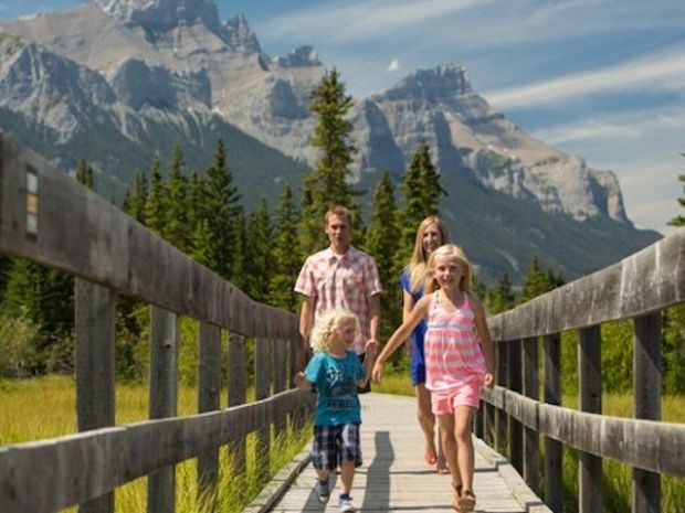 Family walking across Policeman's Creek Boardwalk.