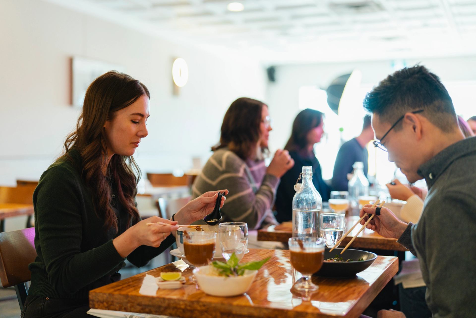Customers enjoying food and beverages at Mot To.