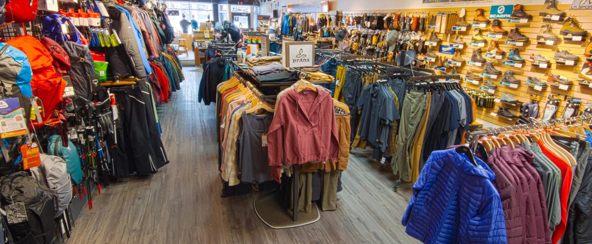 Interior of Gravity Gear store with outdoor clothing and gear neatly displayed.