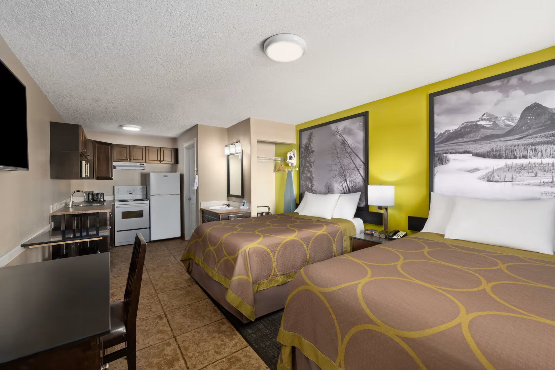 Super 8 by Wyndham Fort McMurray features a guest room with two beds and a kitchenette.  Provide your feedback on BizChat Add captions for two more imagesWrite captions with a cozy toneMake captions more playful FilesFiles