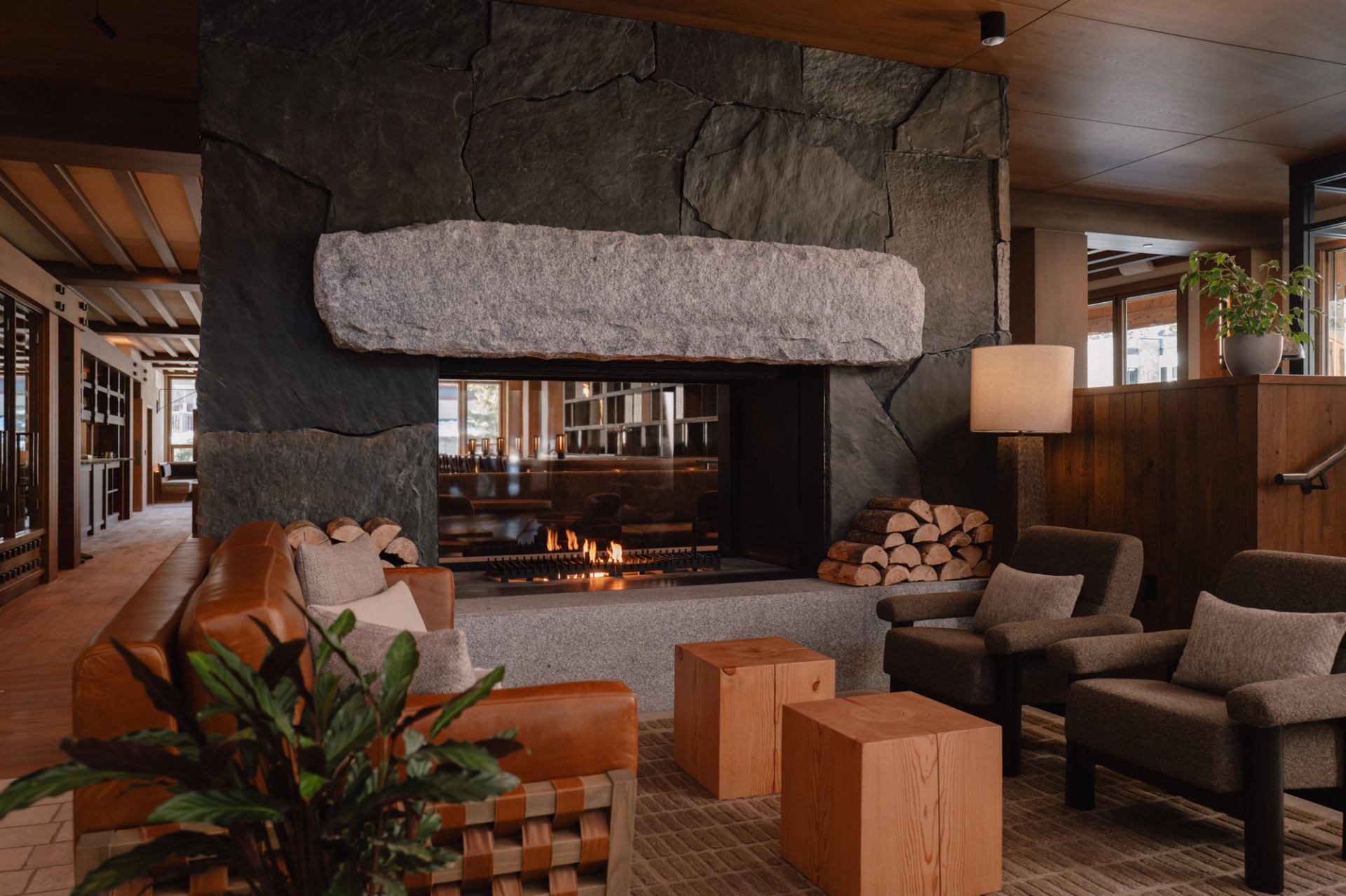 Lobby lounge area in front of a fireplace in Otter Hotel