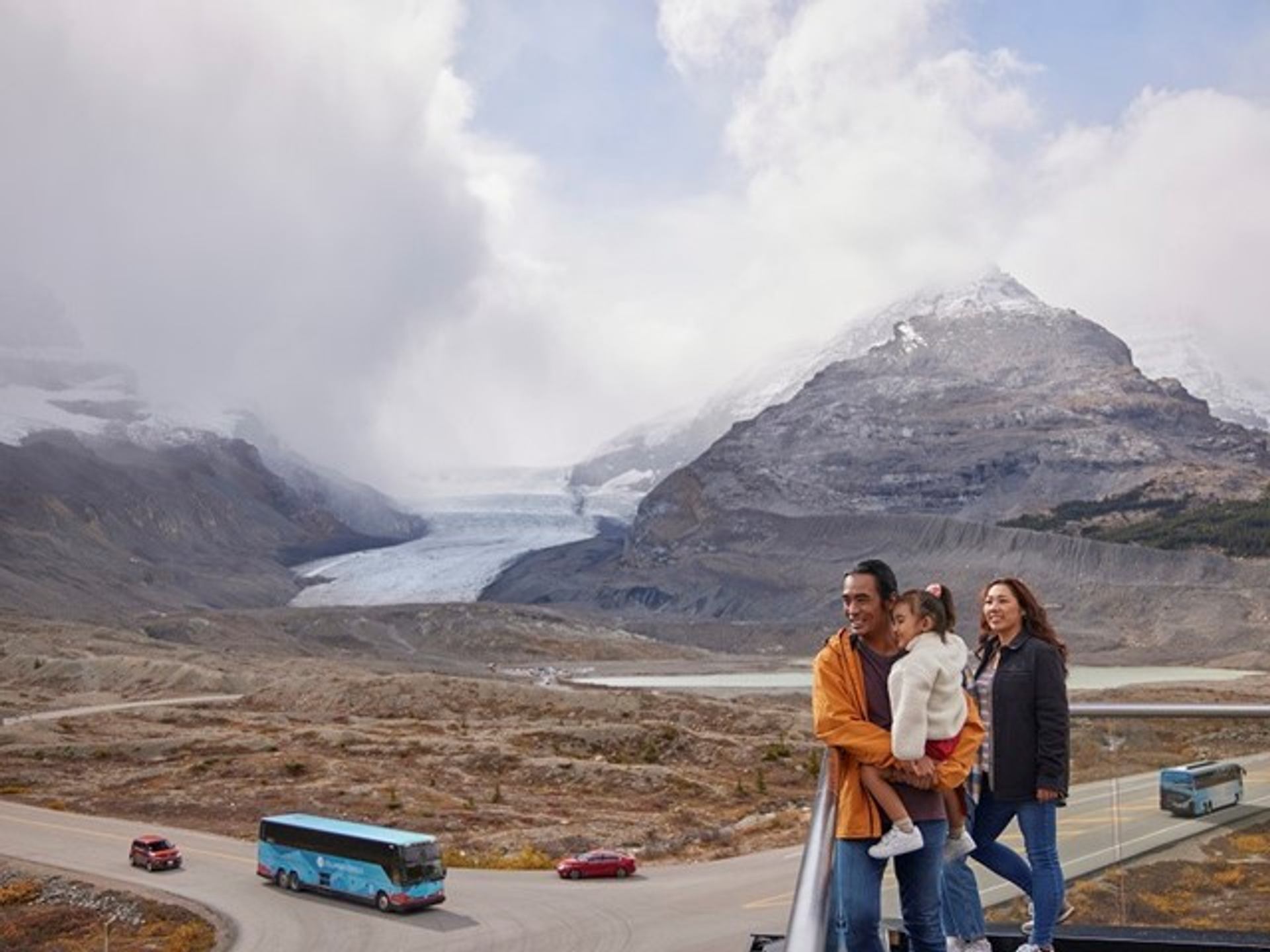 Family looking at the view from the Columbia Icefield Discovery Centre building.