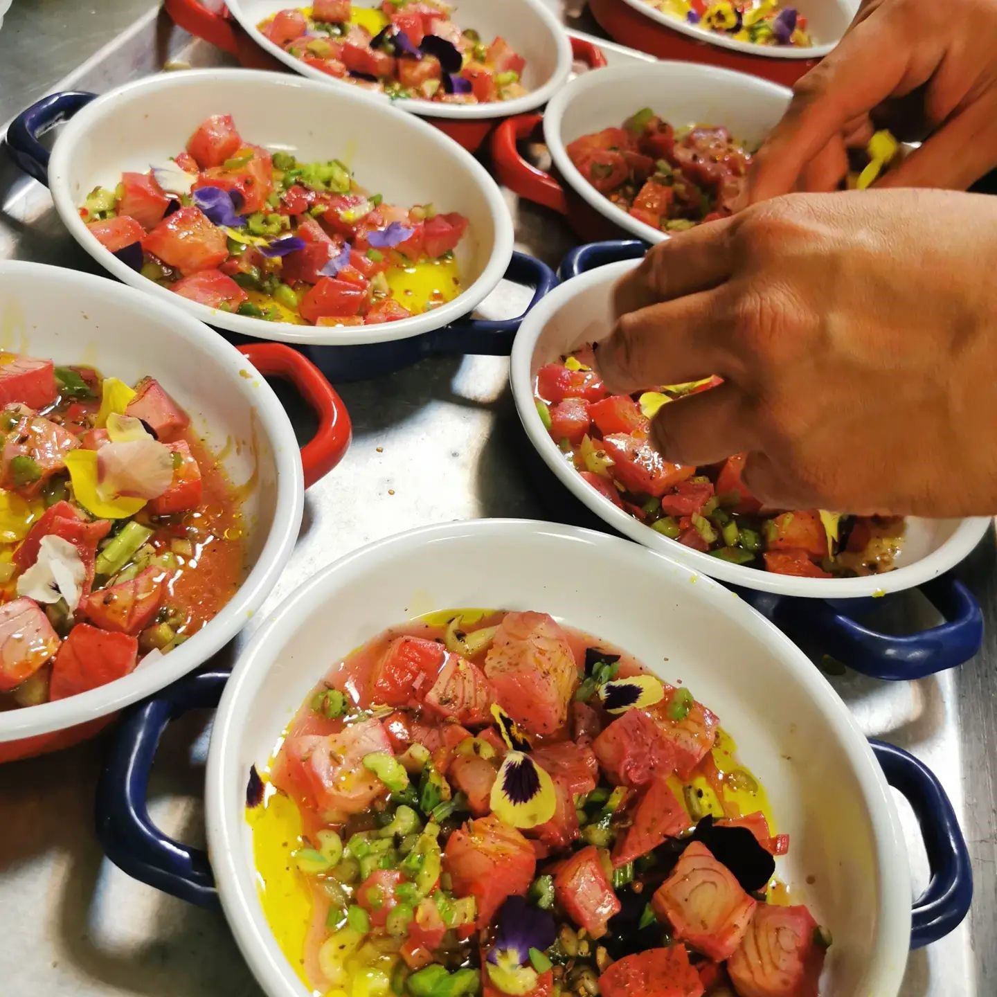A person plating up the food.