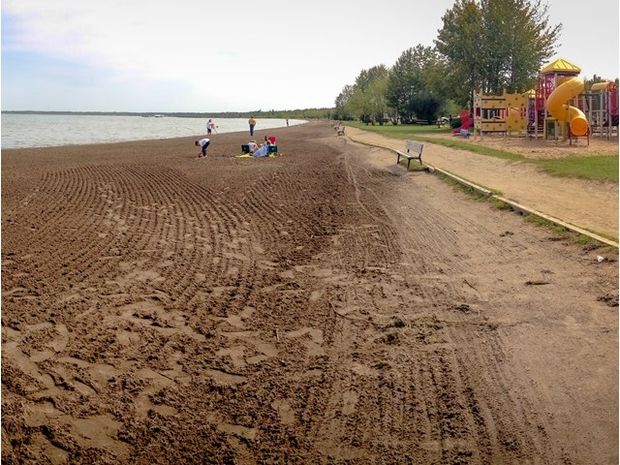 The beach and playground at Aspen Beach Provincial Park.