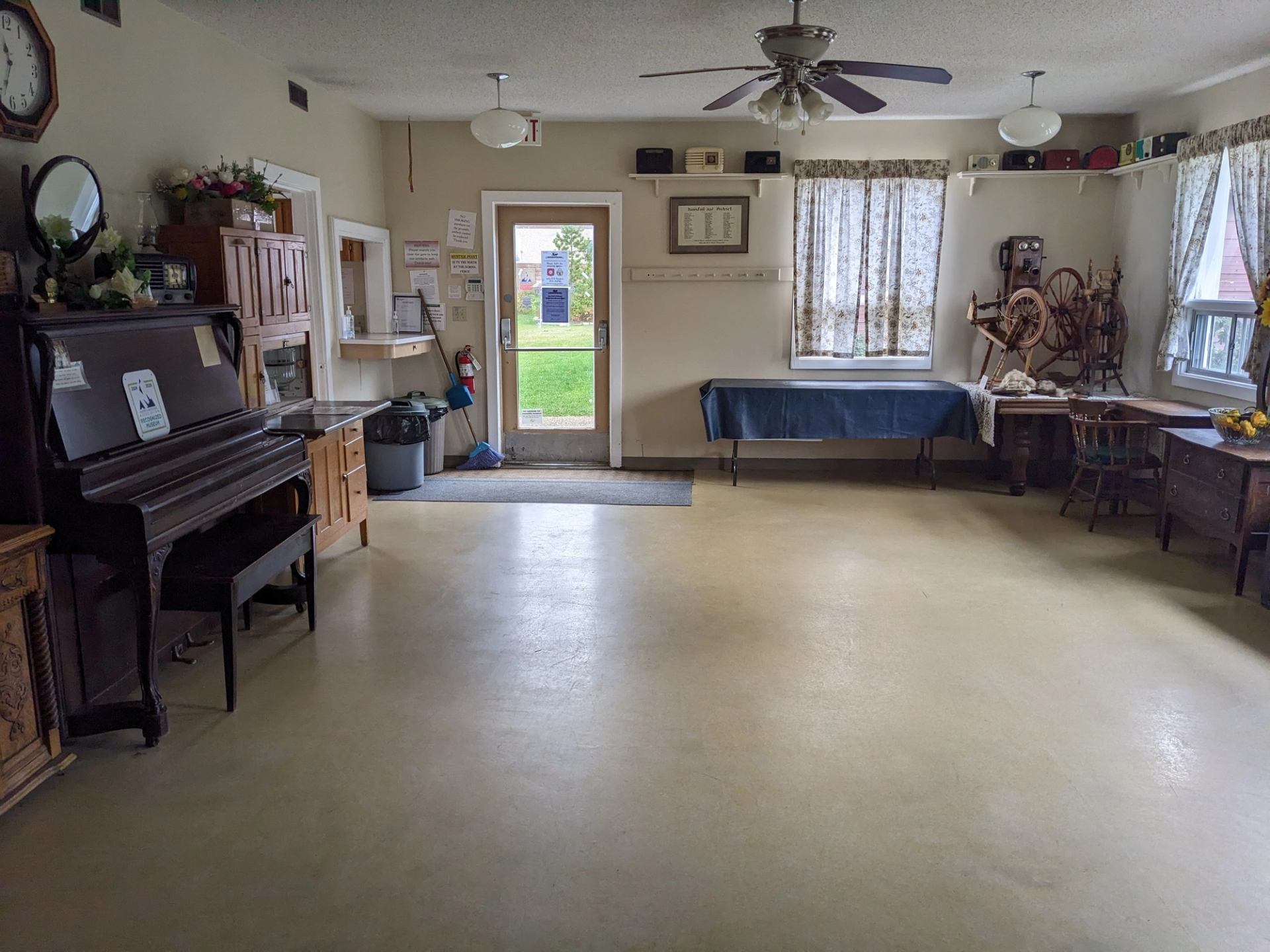 Tea room with piano, vintage tables, and historical charm.