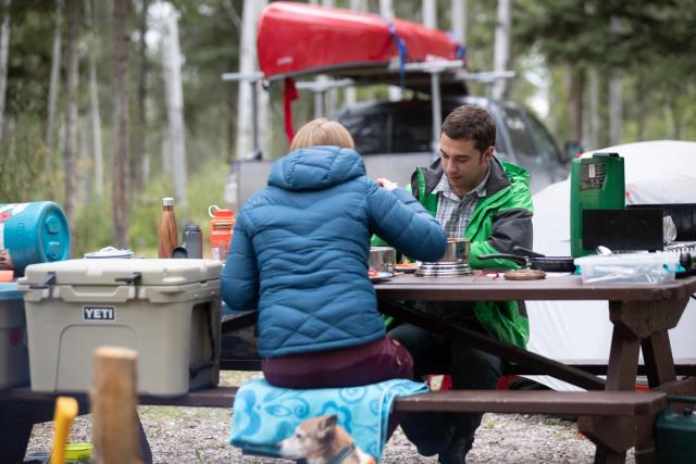 Couple eating at a picnic table at Pine Lake Campground.