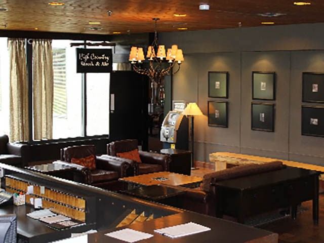 Grande Cache Hotel lounge with leather seating and warm lighting.