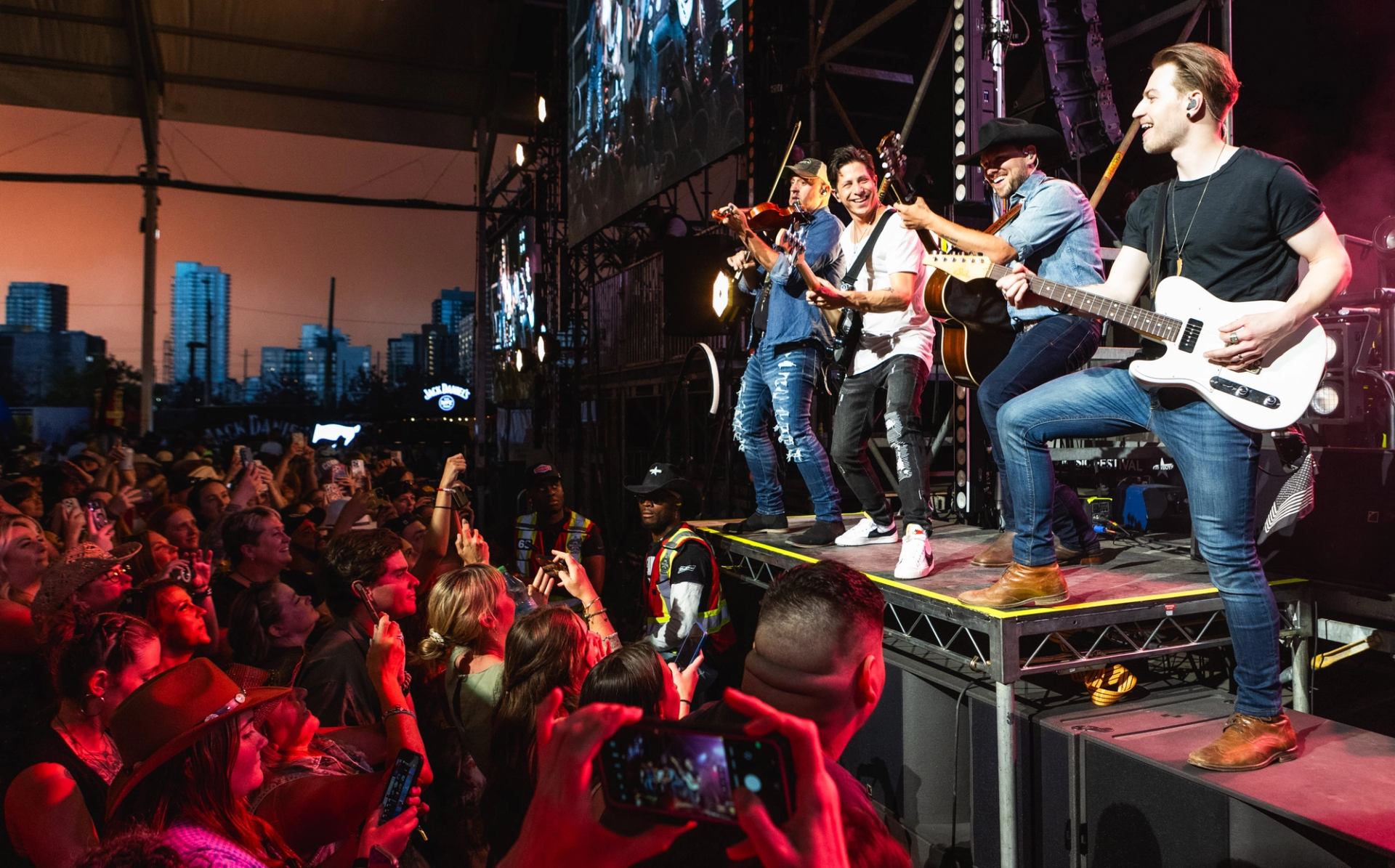 Band playing while the concert goers watch