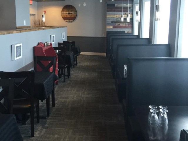 Step into comfort—Our Flames Restaurant & Lounge offers a warm, inviting space for every meal.