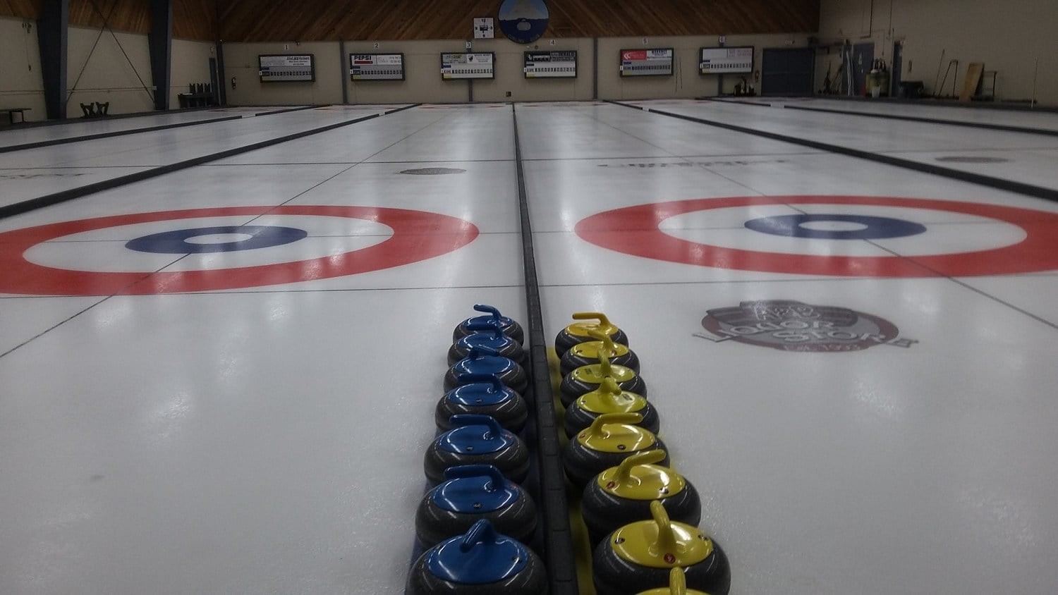 Curling ice with the curling stones lined up