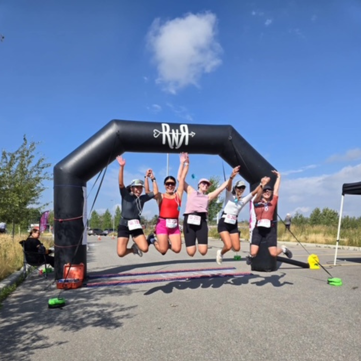 A group jumping at the finish line.