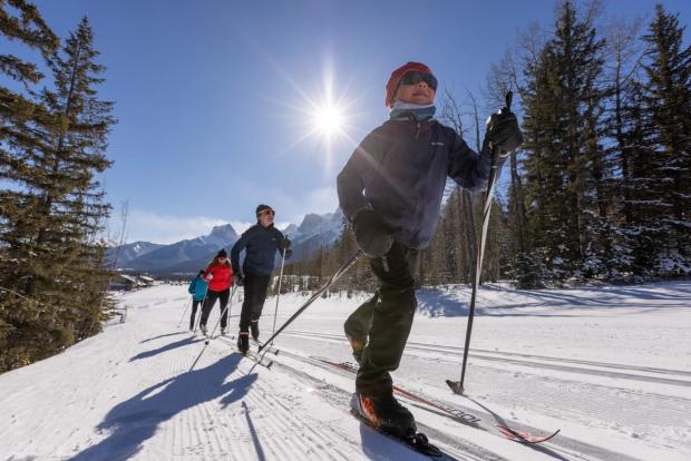 Family  cross country skiing at the Canmore Nordic Centre.