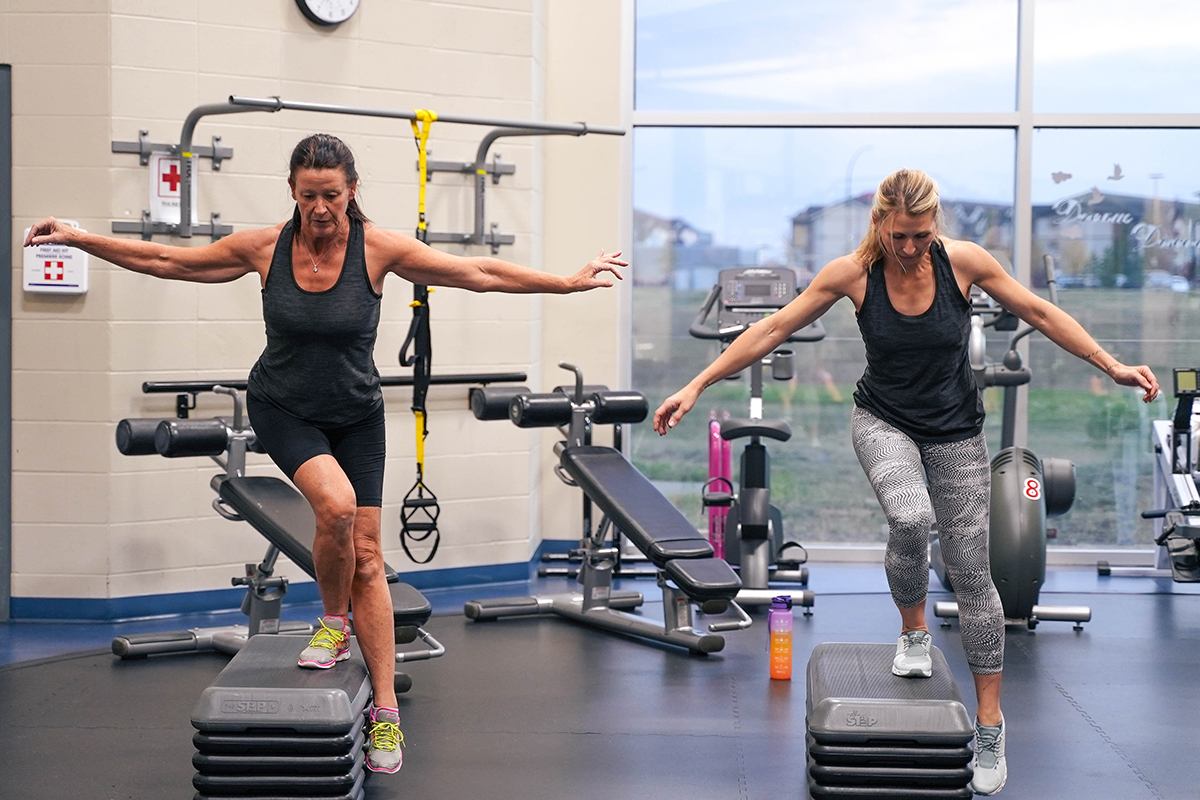 Two women exercising in a Bootcamp class.