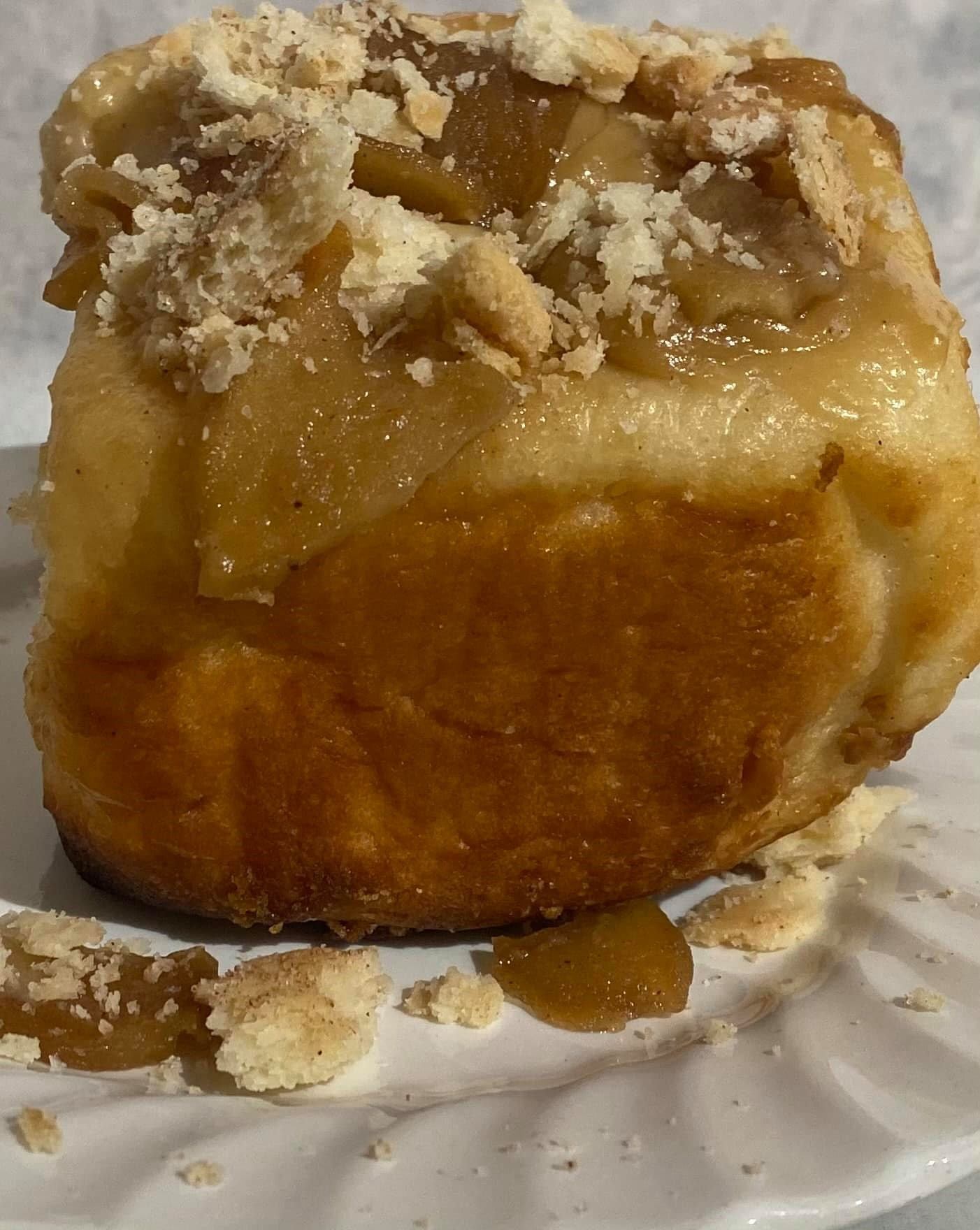 Fluffy pastry topped with apple slices and crumbly streusel