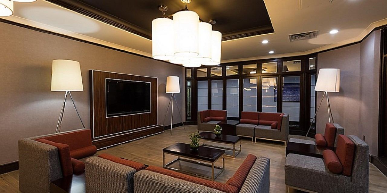 Modern hotel lounge with cozy seating and soft lighting.