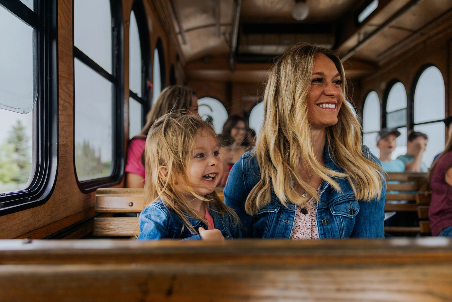 A mother and child enjoying the sights while riding on the trolley