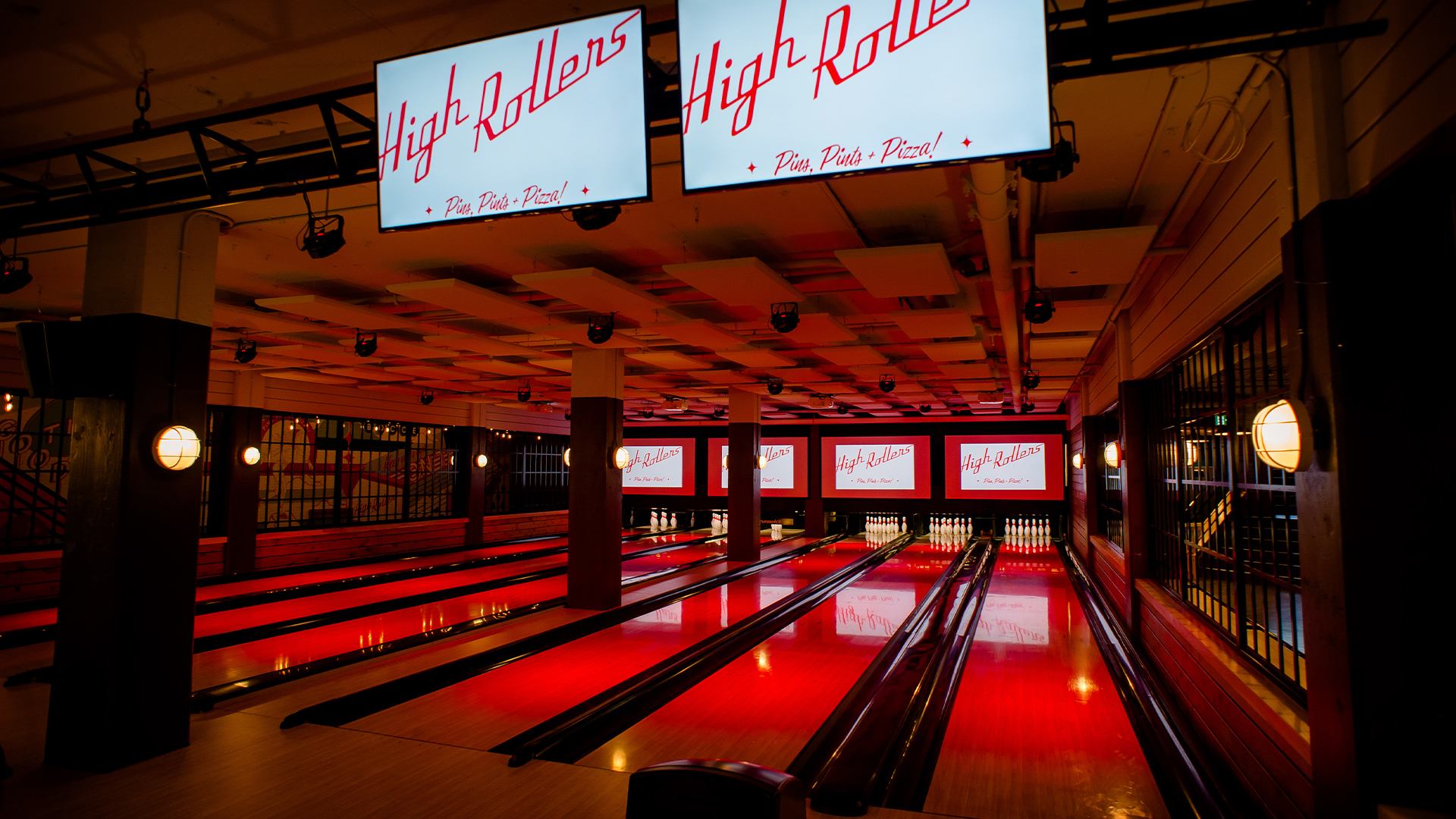 6 bowling lanes with 4 projector screens for sports watching.