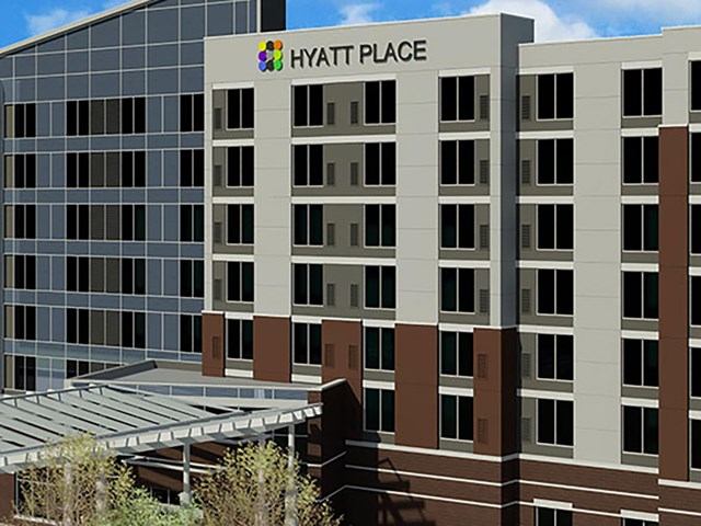 Exterior of Hyatt Place Edmonton West with modern design and logo.