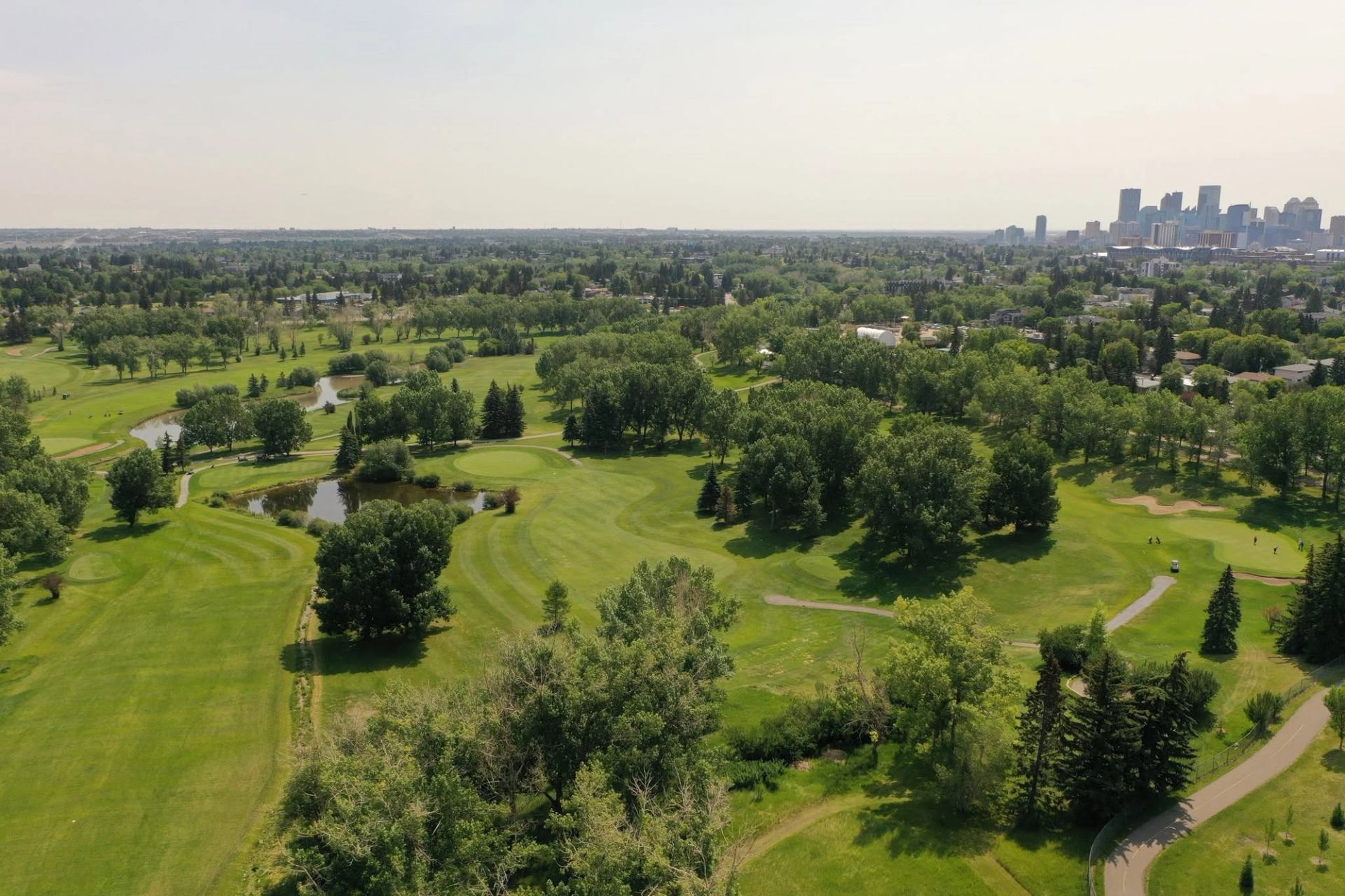 Rolling fairways stretch through an urban oasis, offering scenic views from sunrise to the final putt.