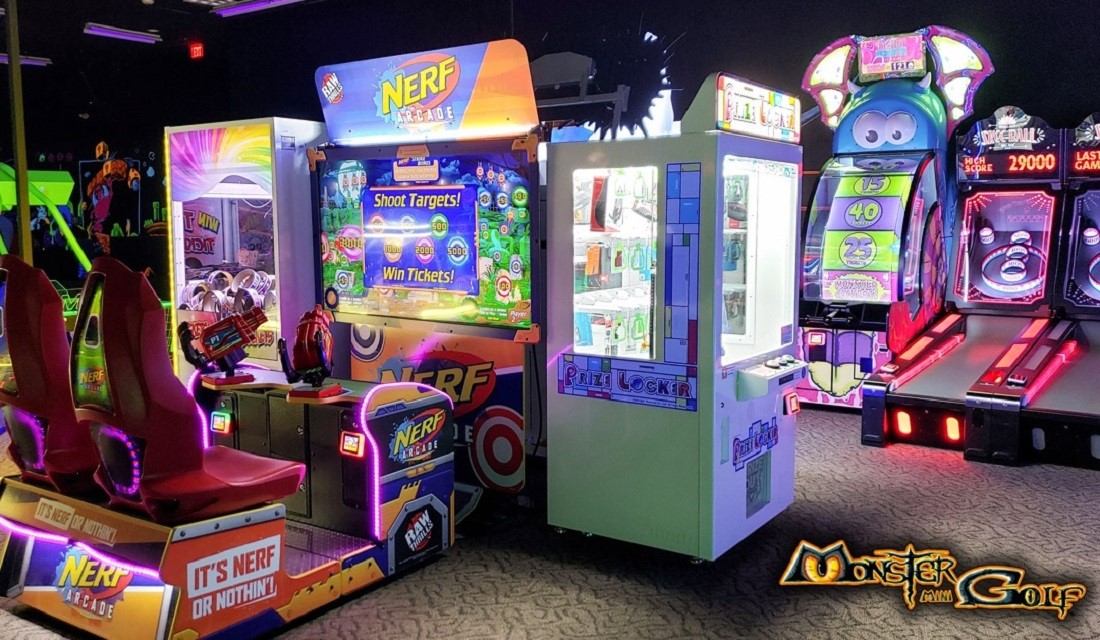 Arcade games with Nerf shooting booth, prize locker machines and skee-ball lanes.