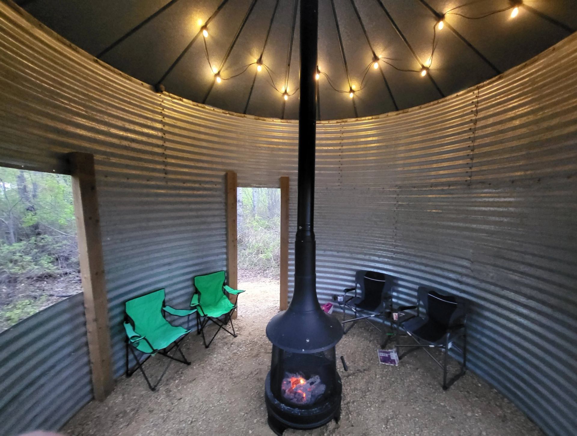 Grain bin gazebo with firepit and chairs