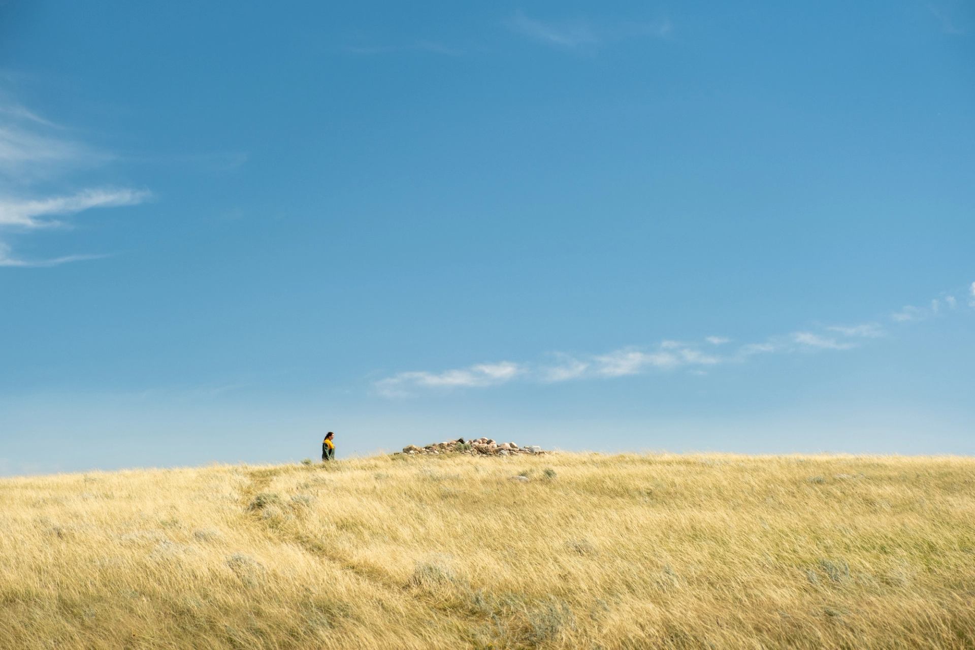 Person viewing the Majorville Cairn and Medicine Wheel.