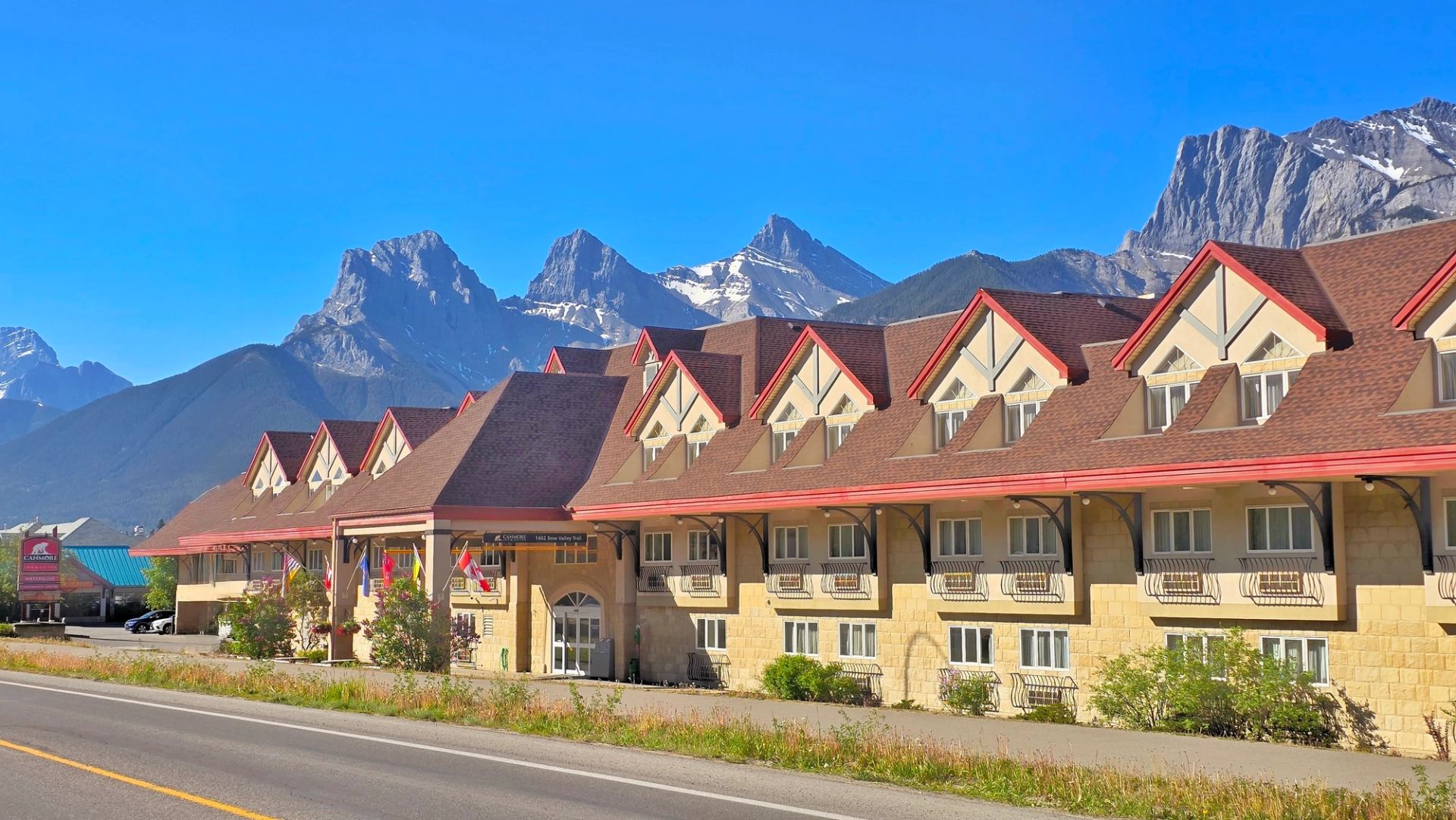 The main building with the Three Sisters Mountains on a background. 