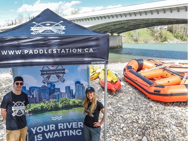 Workers standing at the Paddle Station in Calgary.