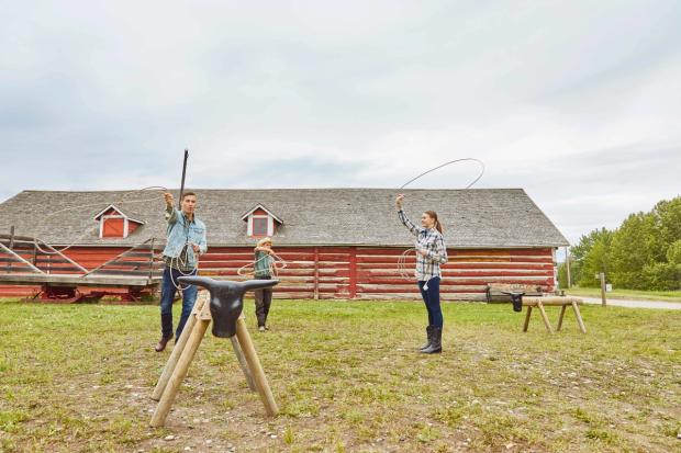 Couple learning how to rope at the historic Bar U Ranch near Longview.