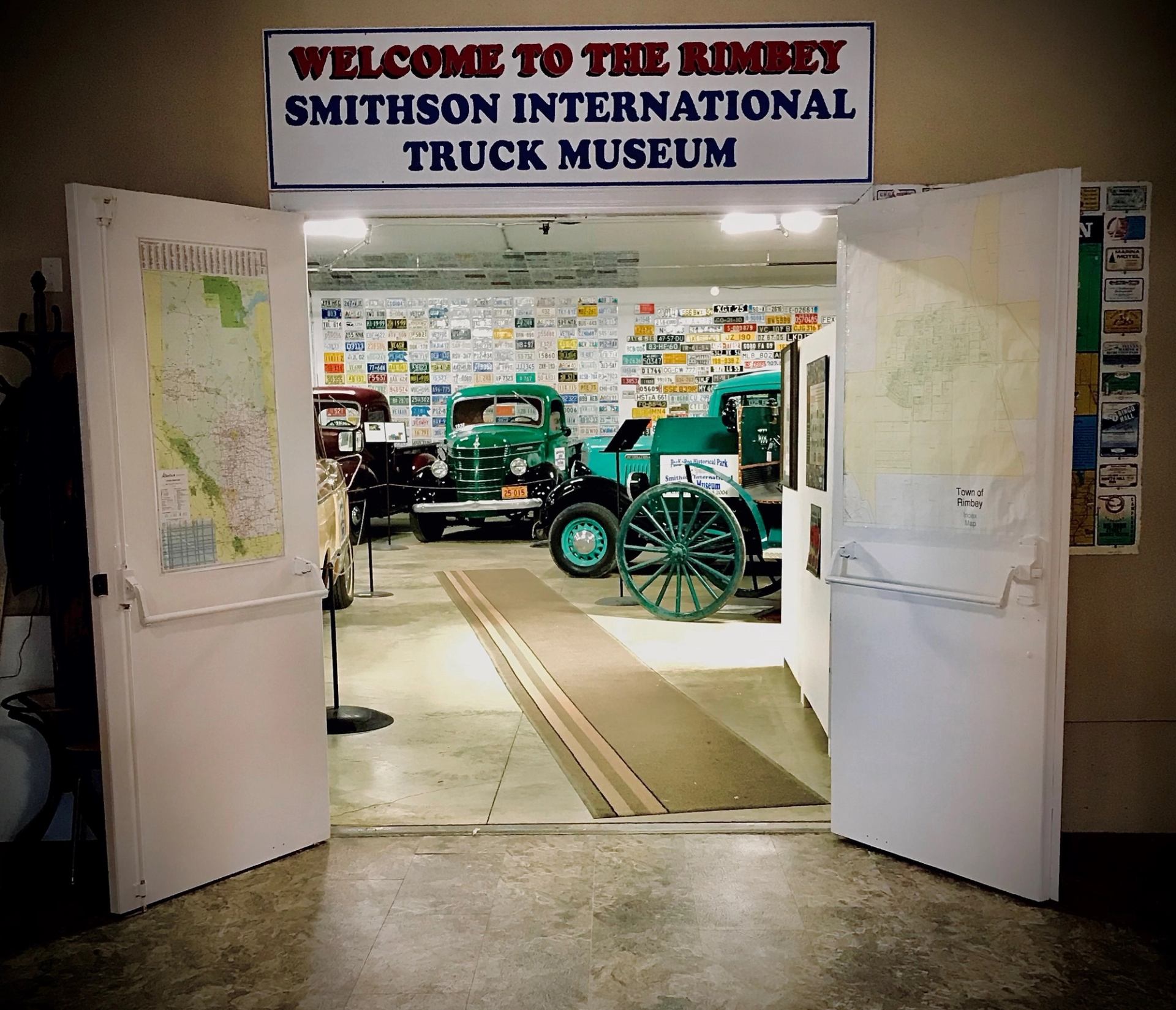 Entrance to truck museum with antique vehicles inside