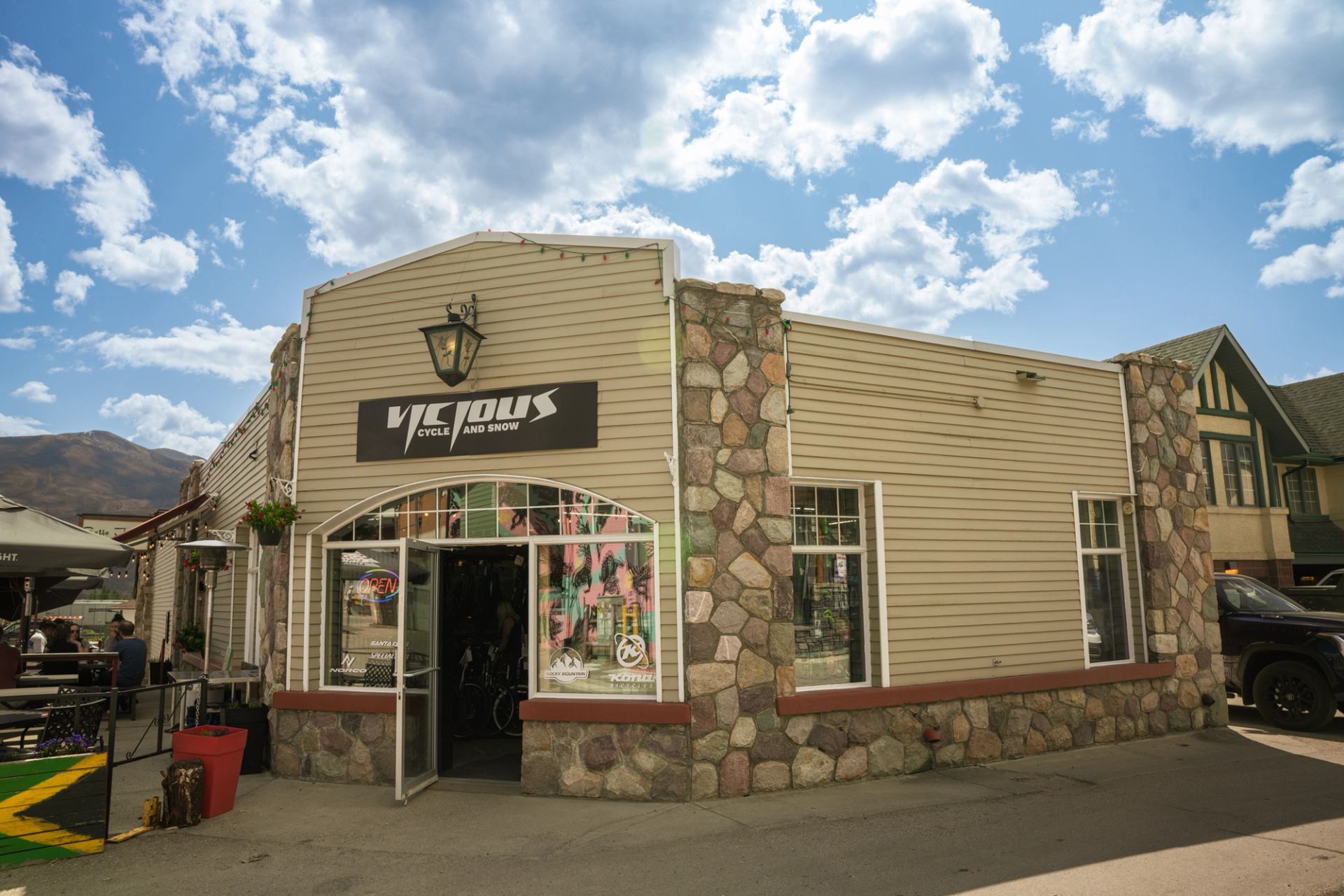 Vicious Cycle & Snow bike shop with stone and wood exterior in Jasper.