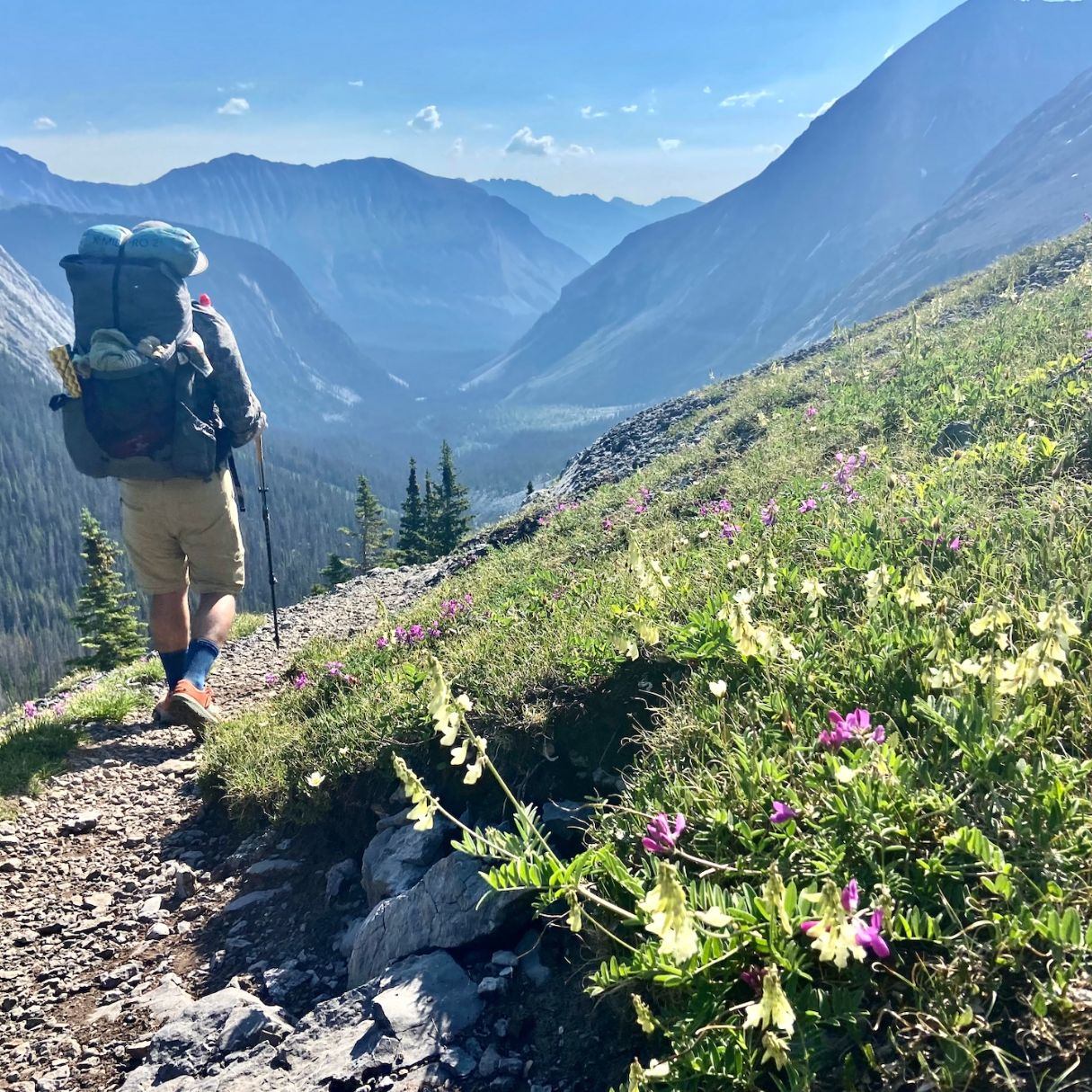 A person hiking with a backpack on.