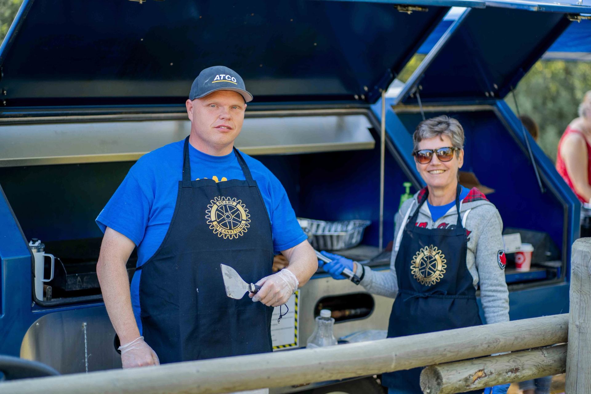 Rotary Club volunteers cooking up a pancake breakfast for Beach Fest attendees.