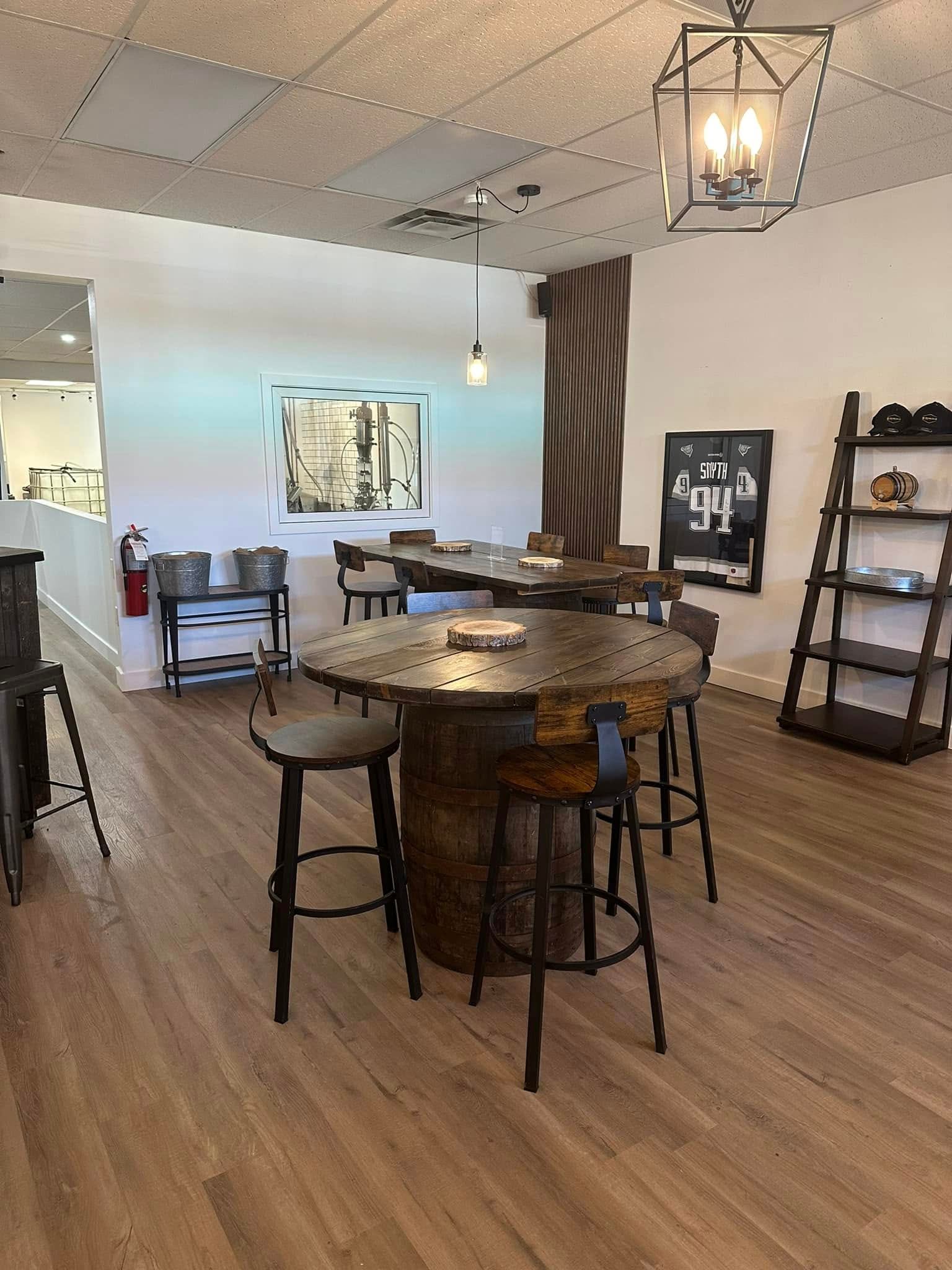 Interior of the distillery with barrel tables and chairs