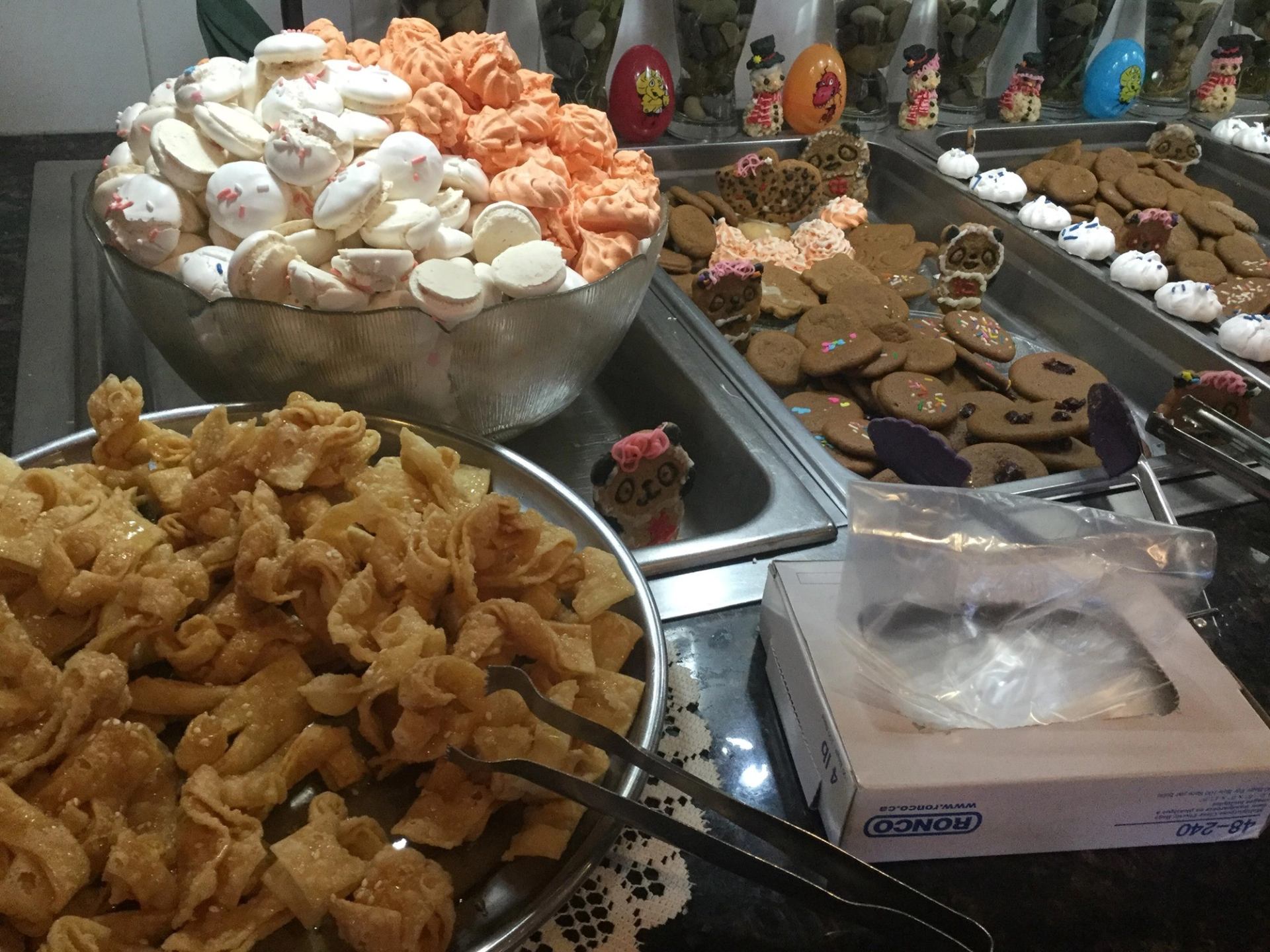 Counter with fried snacks, sweet treats, and cookies at Happy Valley Restaurant.
