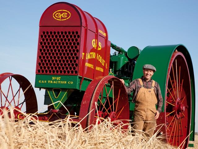Man standing by agriculture equipment