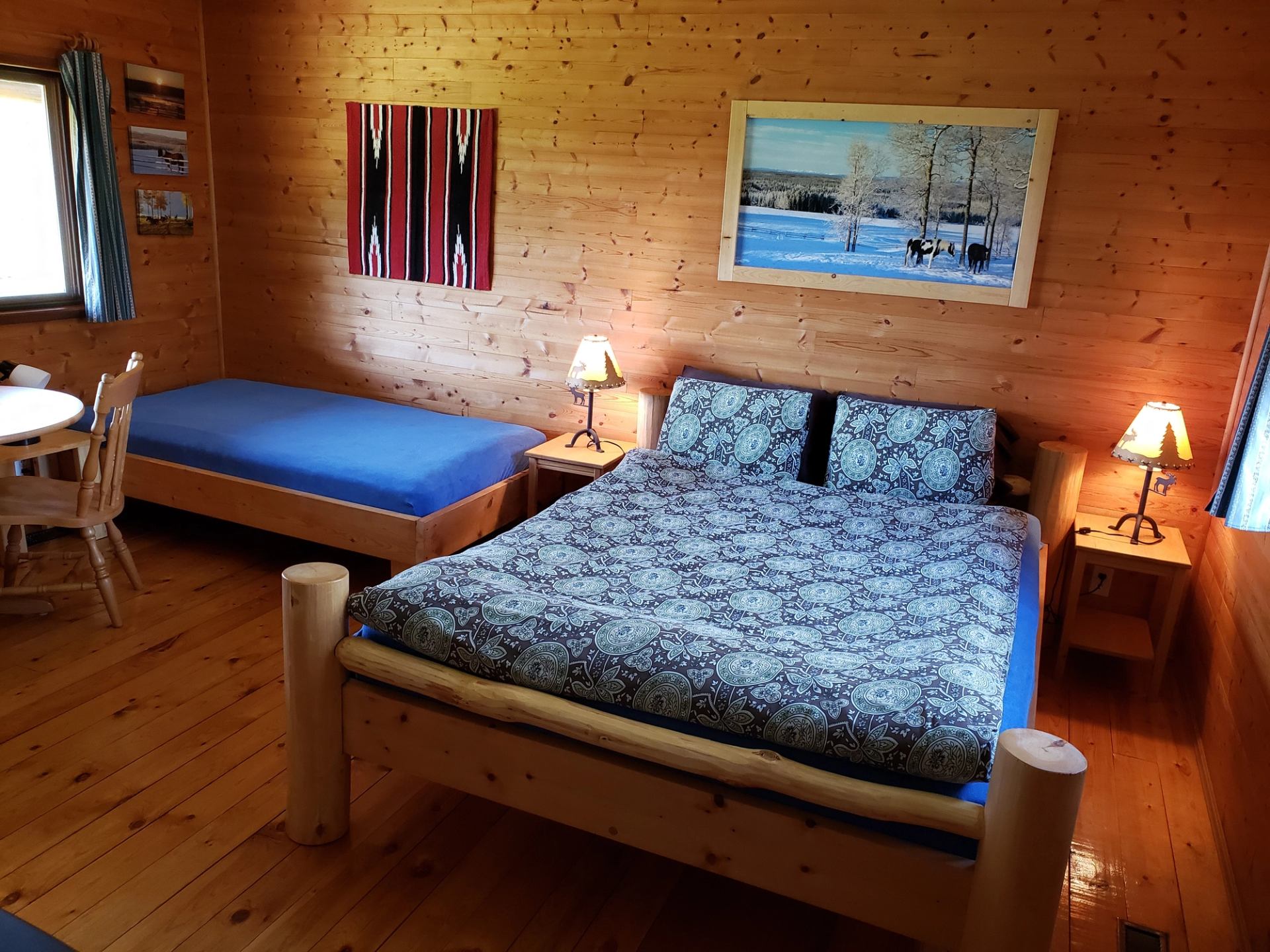 The bedroom inside of a cabin at Ride the Wind Ranch.