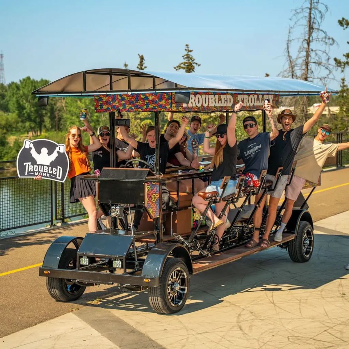 Troubled Monk Brewery welcomes guests aboard a group pedal tour through the community.
