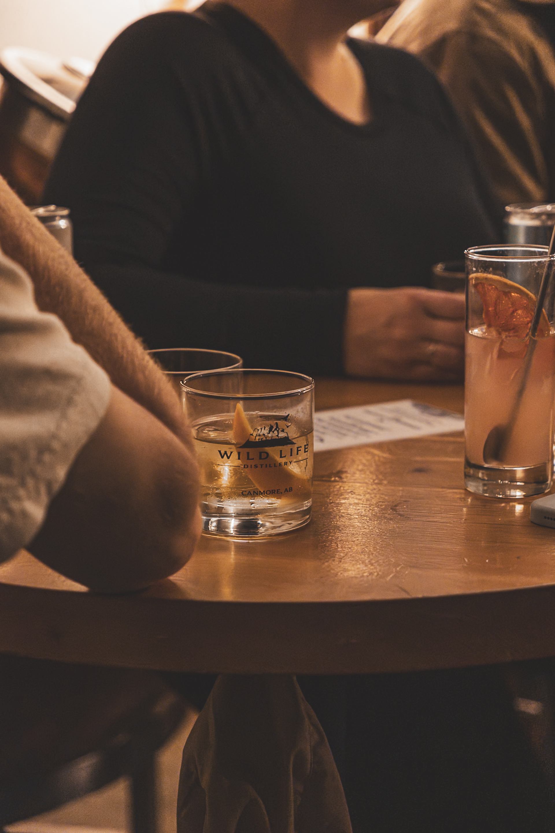 Local community enjoying WLD Hour Craft Cocktails during Open Mic Nights at Wild Life Distillery