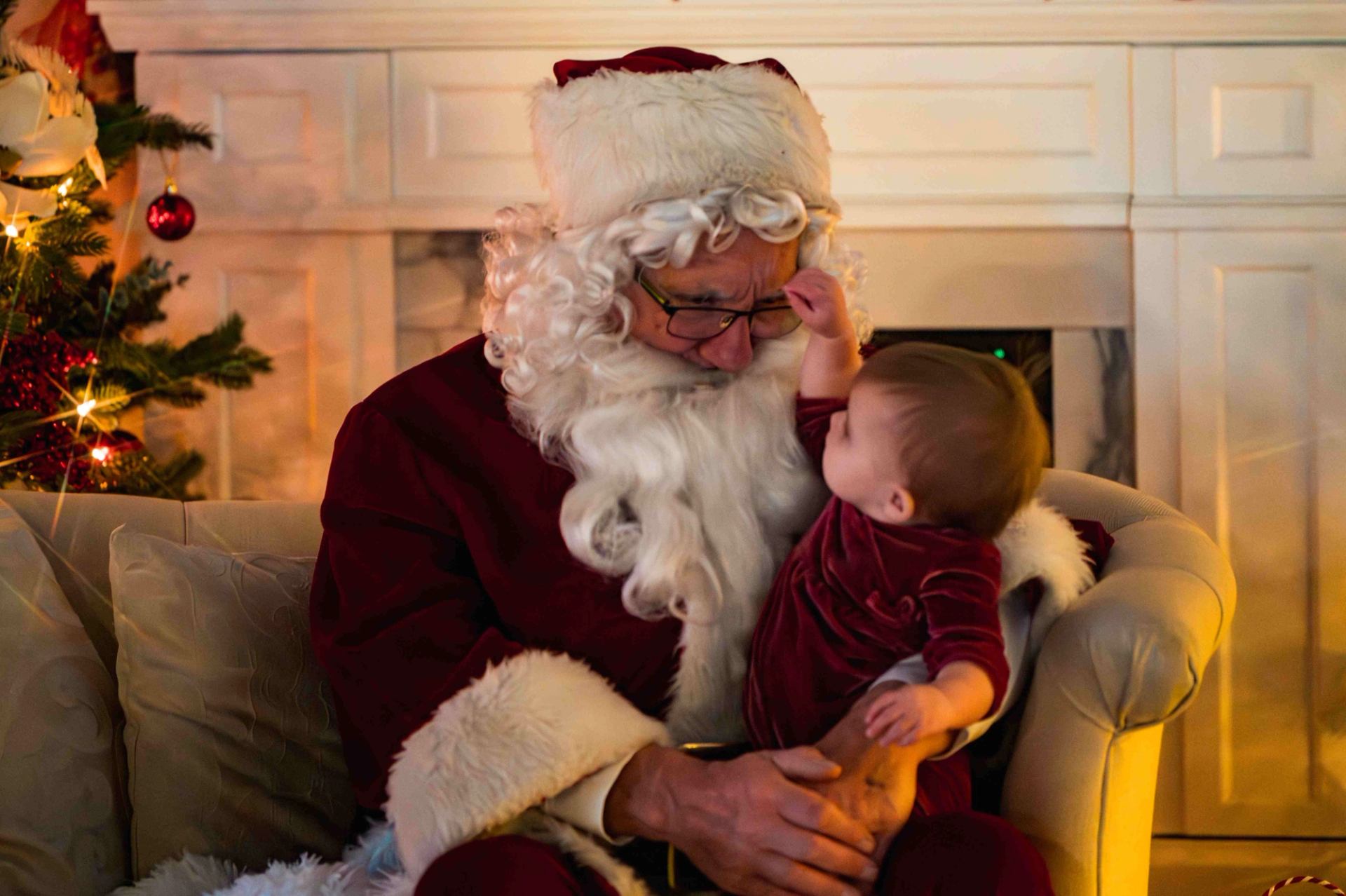 Santa holding a small child