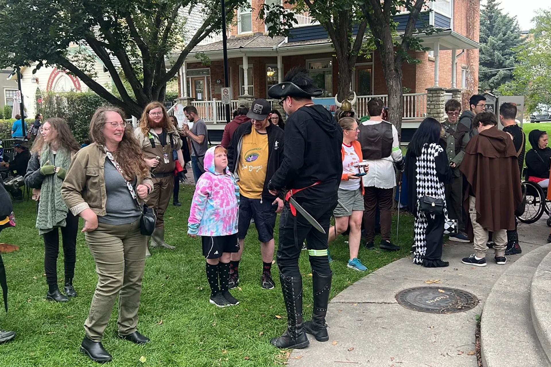 A group of people gathered outside for the Enchanted Okotoks event.