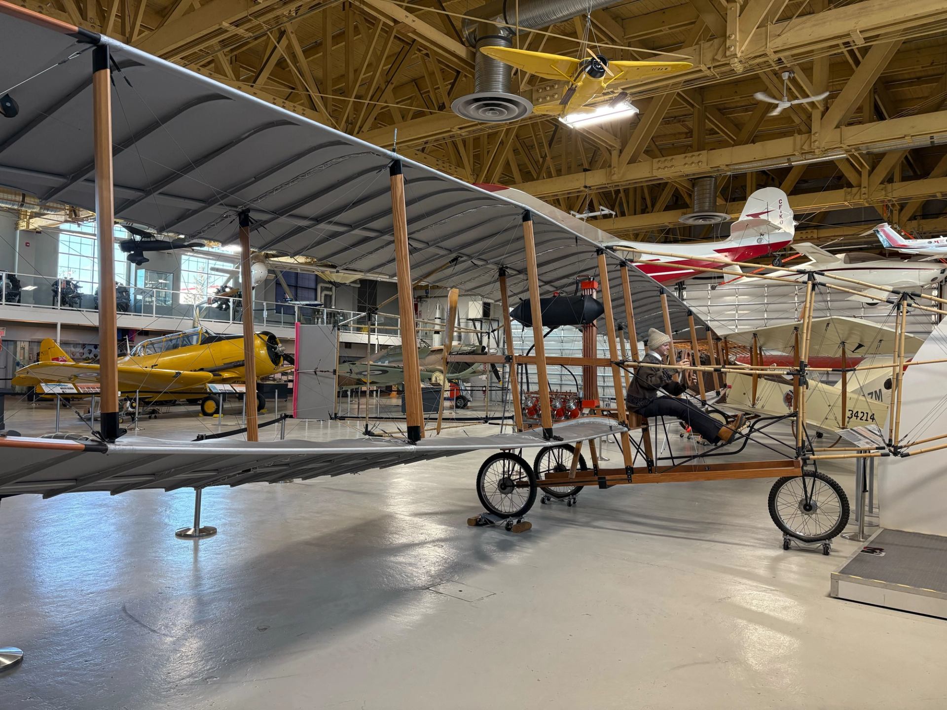 Historic early aircraft displayed inside an aviation museum hangar during National Aviation Weekend.
