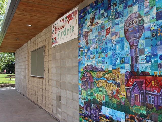 Mosaic artwork on the side of building in Nose Creek Regional Park.