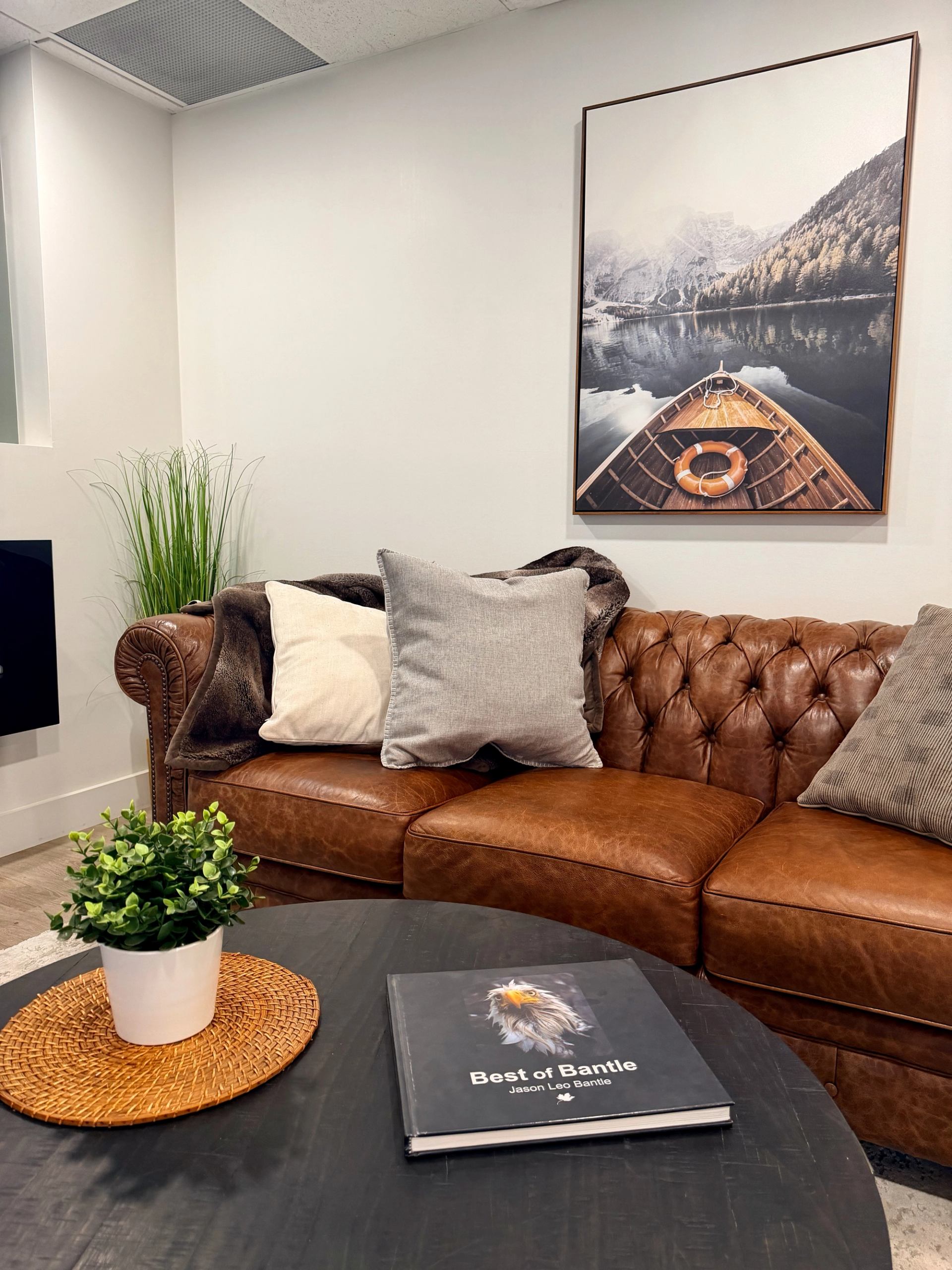 A comfy leather couch in a boutique spa lounge at Bodhi Wellness Canmore