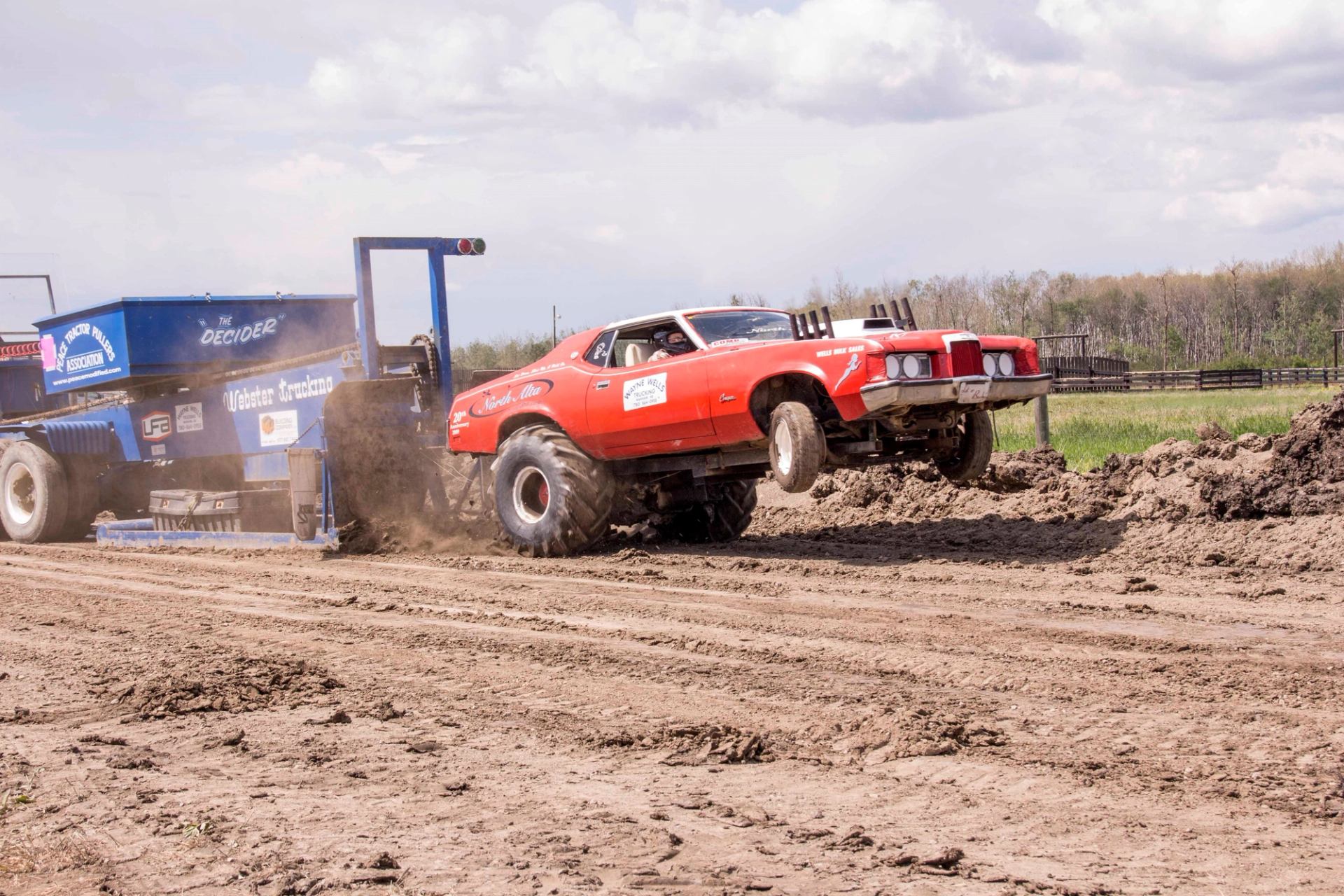 A car pulling a tractor