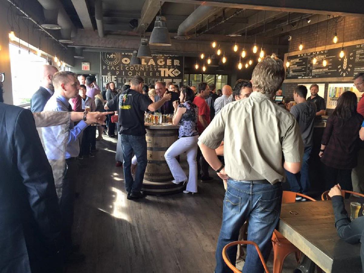 A group of people enjoying GP Brewing Co.