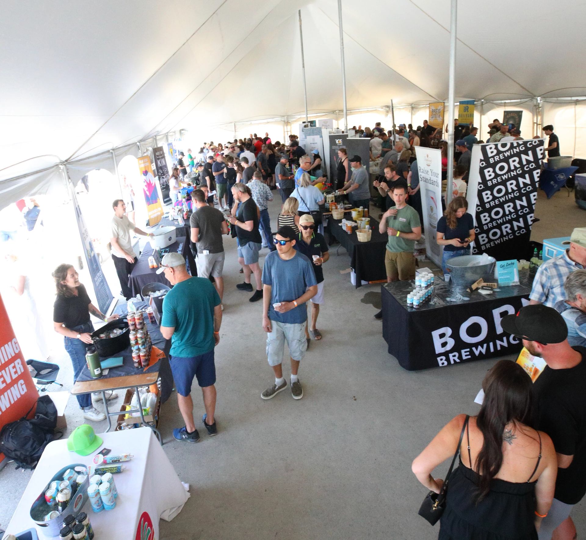 Guests explore brewery booths at Libations Fest