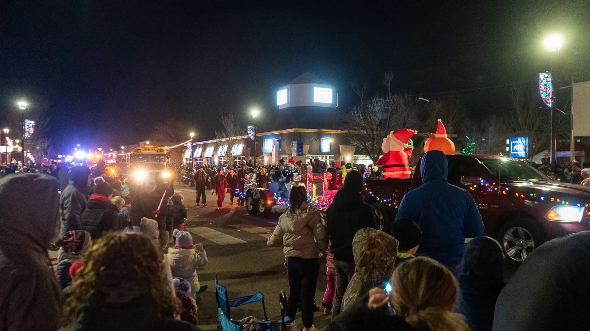 The crowd stood watching the parade